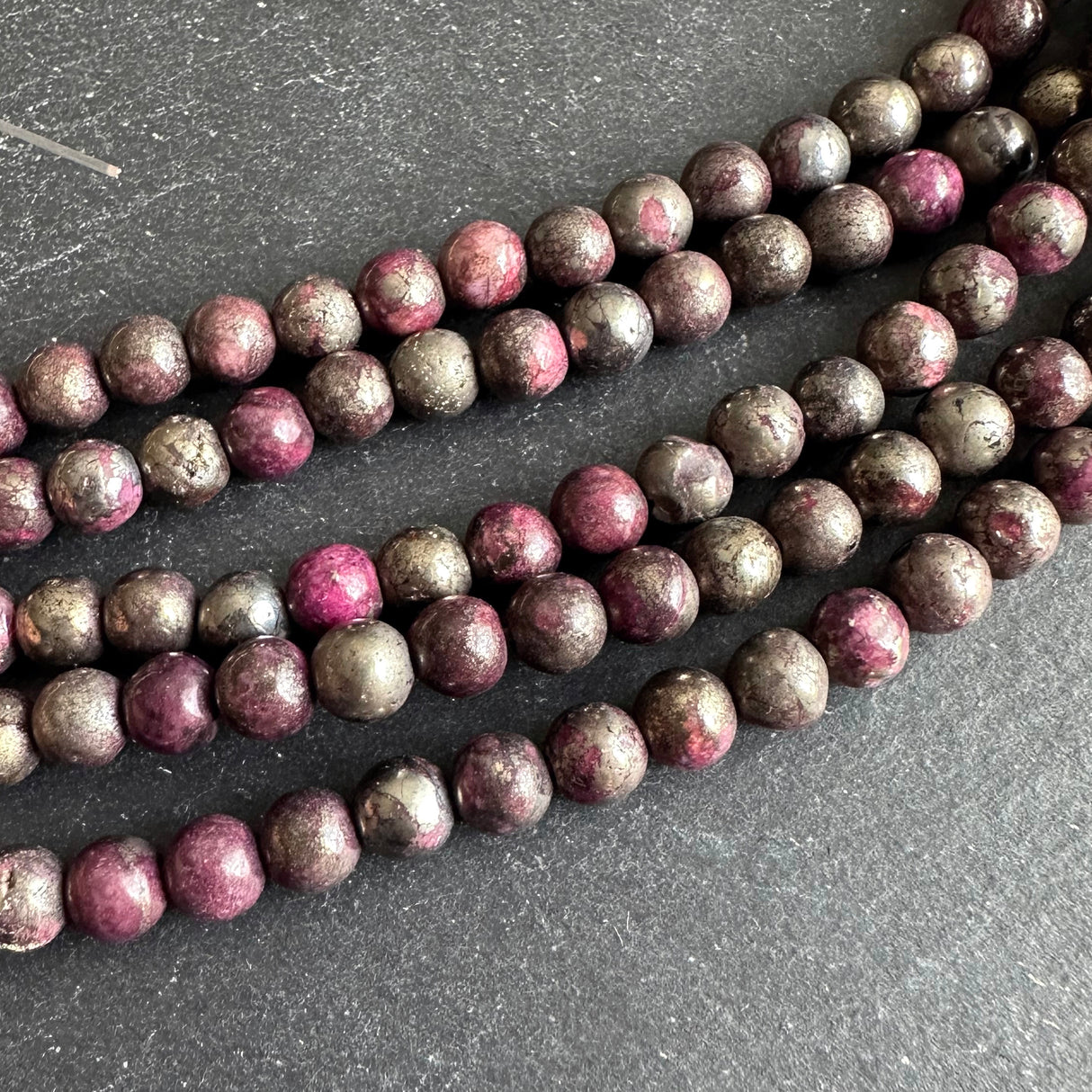 6mm pink pyrite stone beads - round - smooth - 15" strand - approx. 65 beads