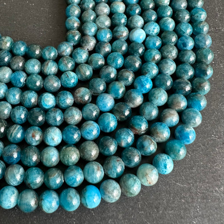 6mm blue apatite beads - round - smooth - 15" strand - approx. 65 beads