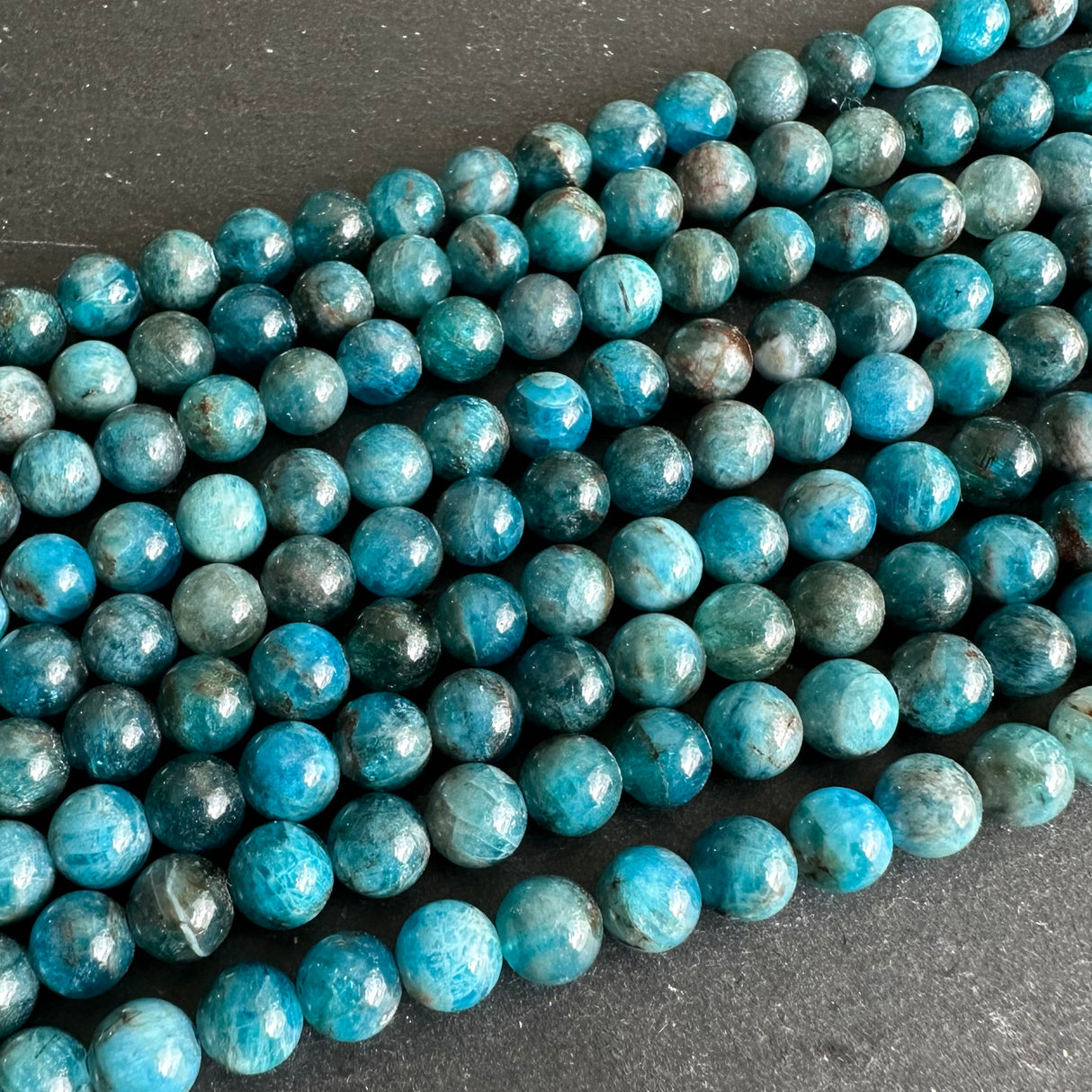 6mm blue apatite beads - round - smooth - 15" strand - approx. 65 beads