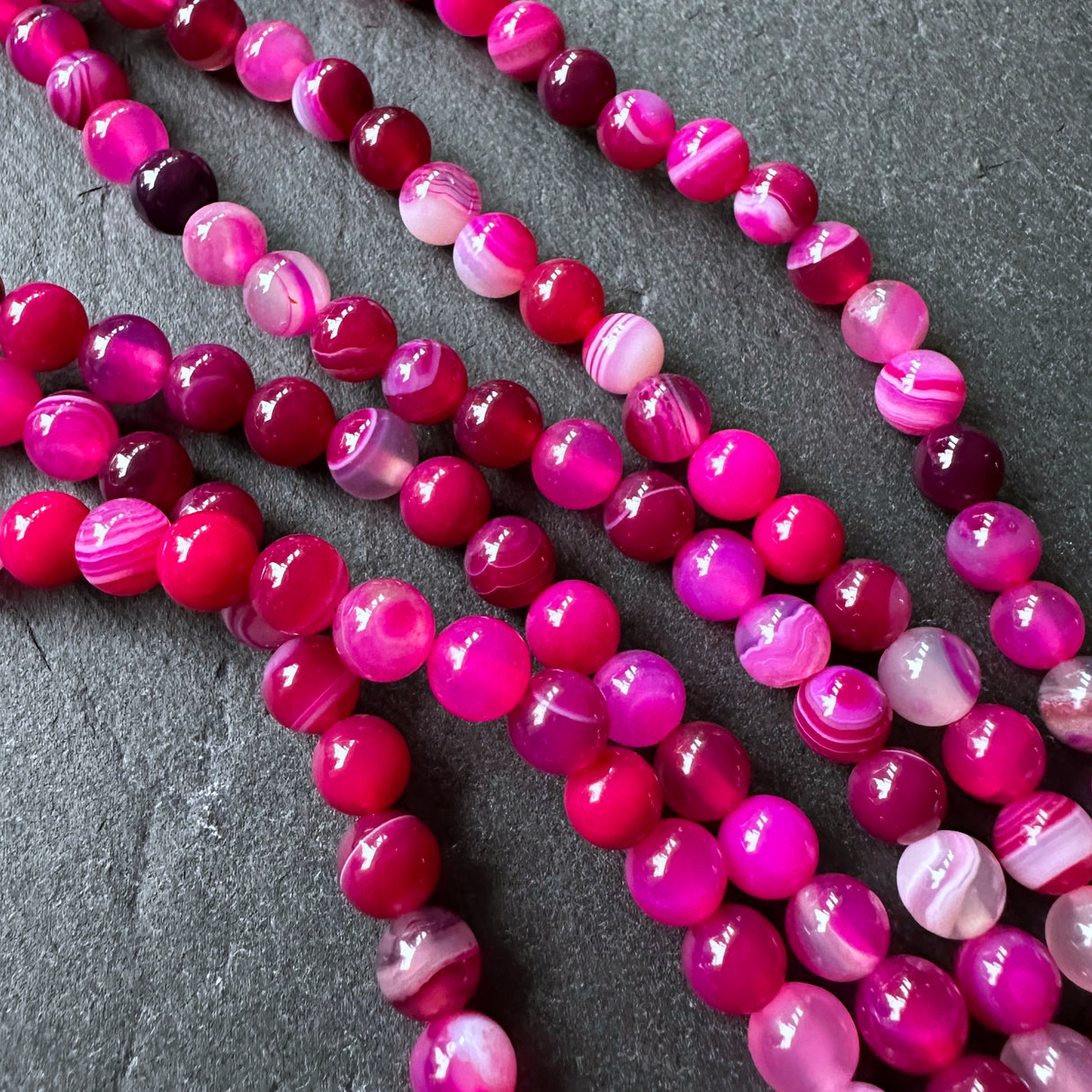 6mm pink striped agate beads - round - smooth - 15" strand - approx. 60 beads