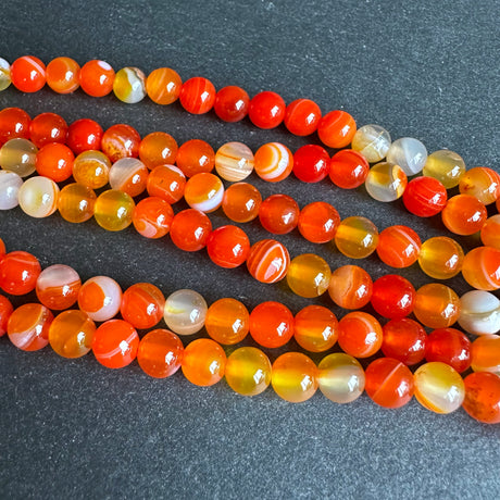 6mm orange striped agate beads - round - smooth - 15" strand - approx. 60 beads