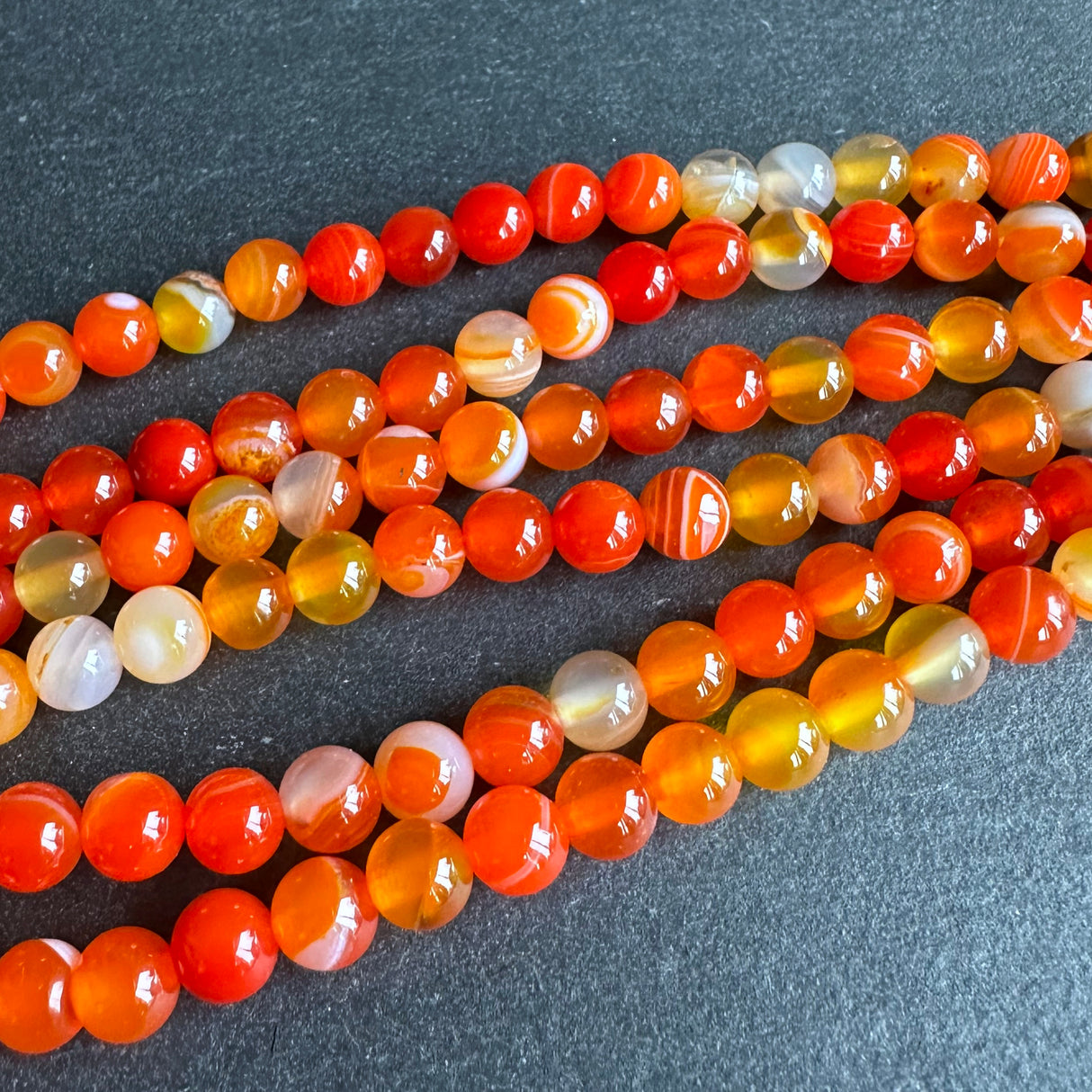 6mm orange striped agate beads - round - smooth - 15" strand - approx. 60 beads