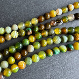 6mm yellow green striped agate beads - round - smooth - 15" strand - approx. 60 beads