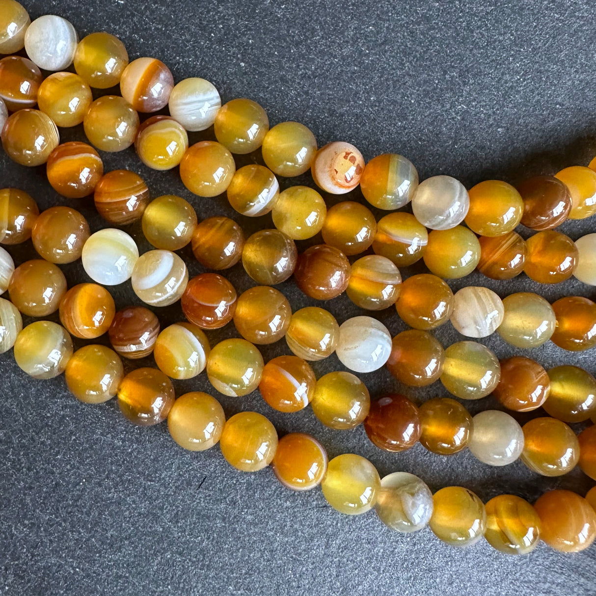 6mm honey gold striped agate beads - round - smooth - 15" strand - approx. 60 beads