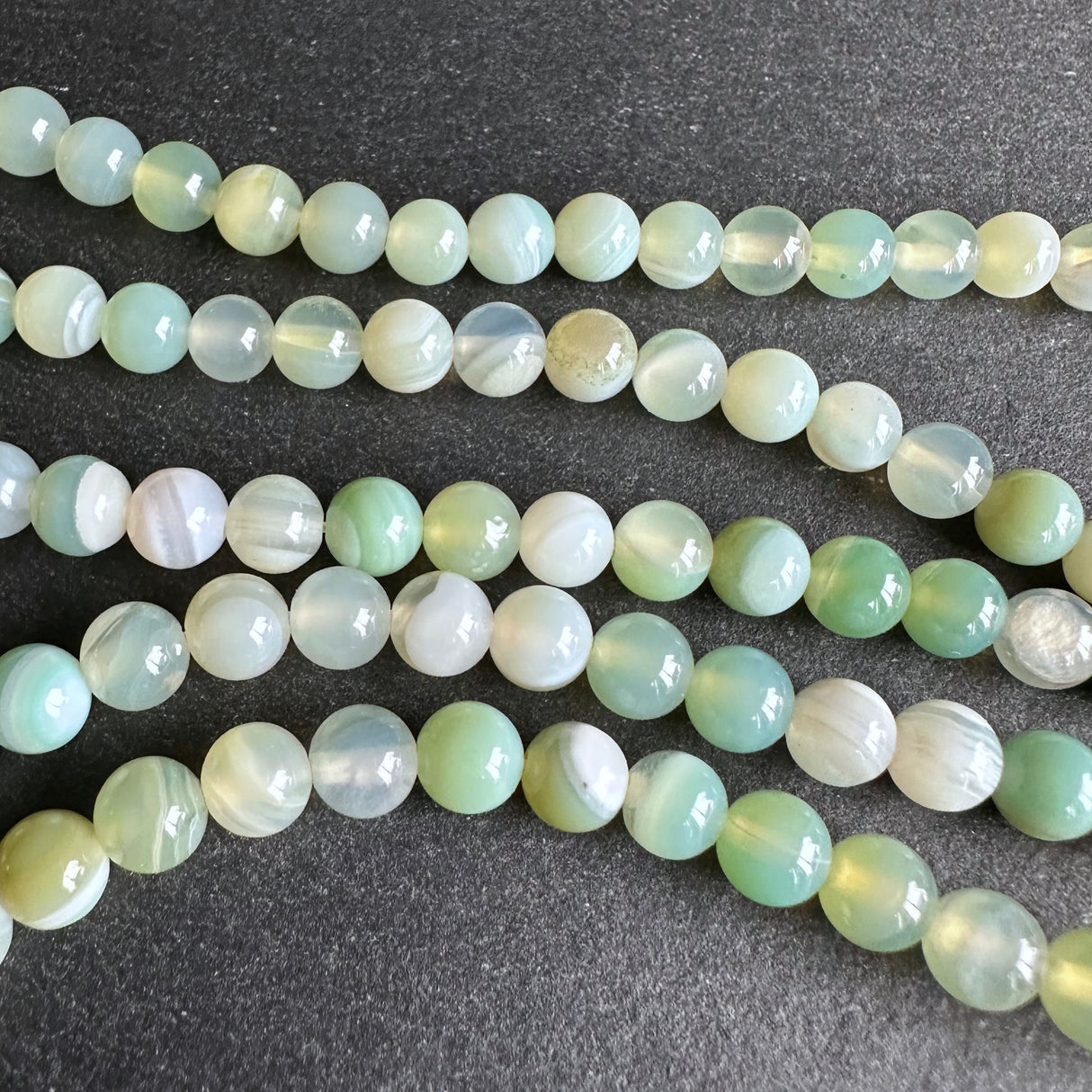 6mm light green striped agate beads - round - smooth - 15" strand - approx. 60 beads