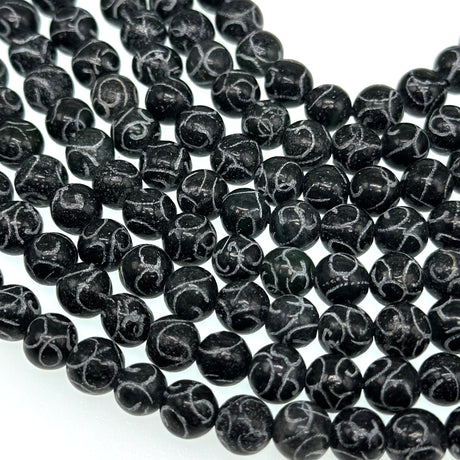 8mm black jade - round - carved - 15" strand - approx. 50 baeds