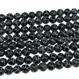 8mm black jade - round - carved - 15" strand - approx. 50 baeds