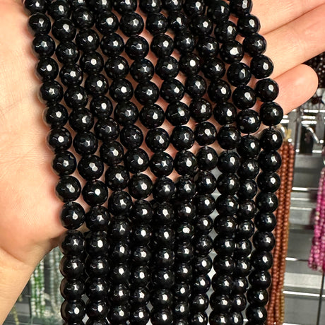 8mm black glass - round- faceted (dyed)