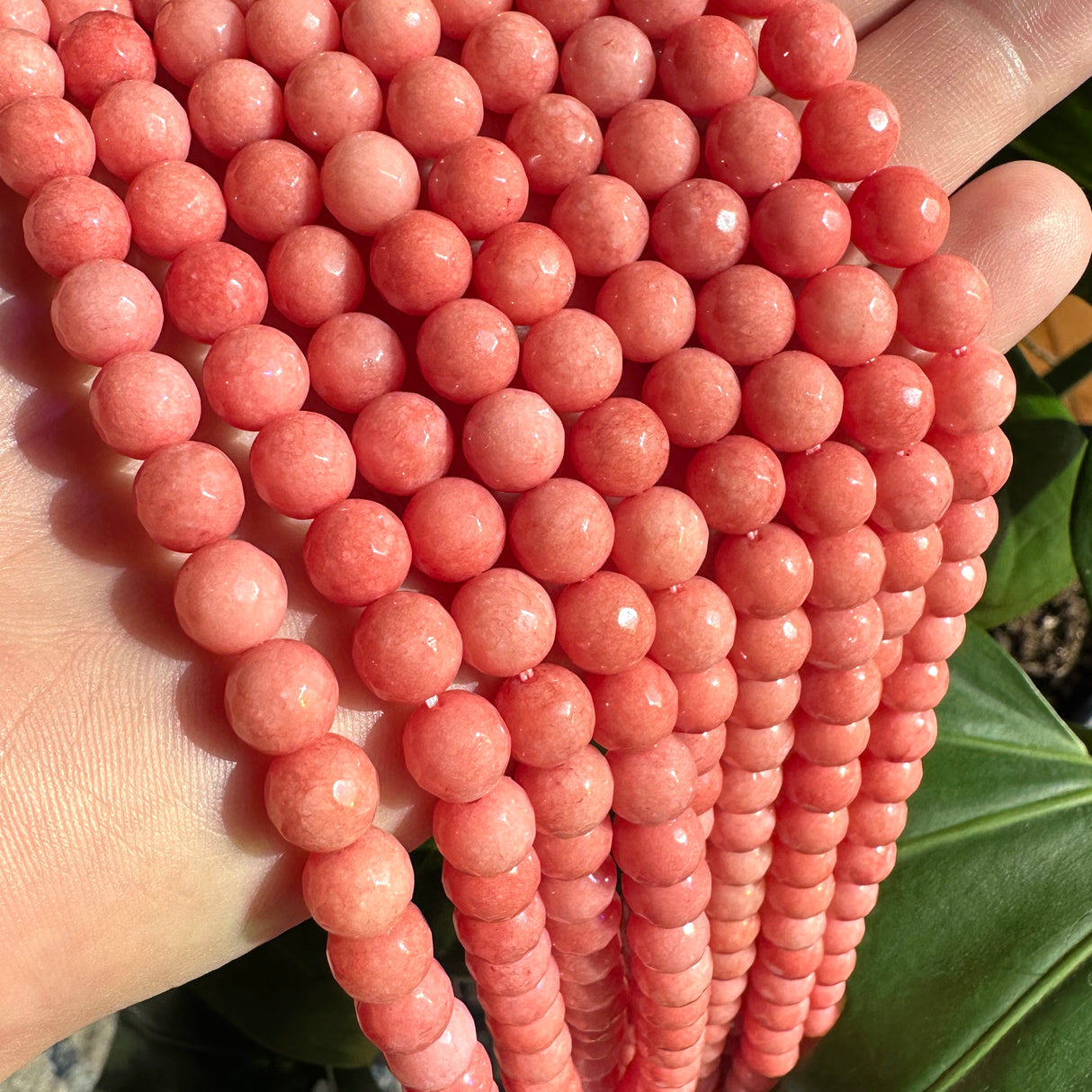 8mm coral candy jade (quartz) - round- faceted (dyed)