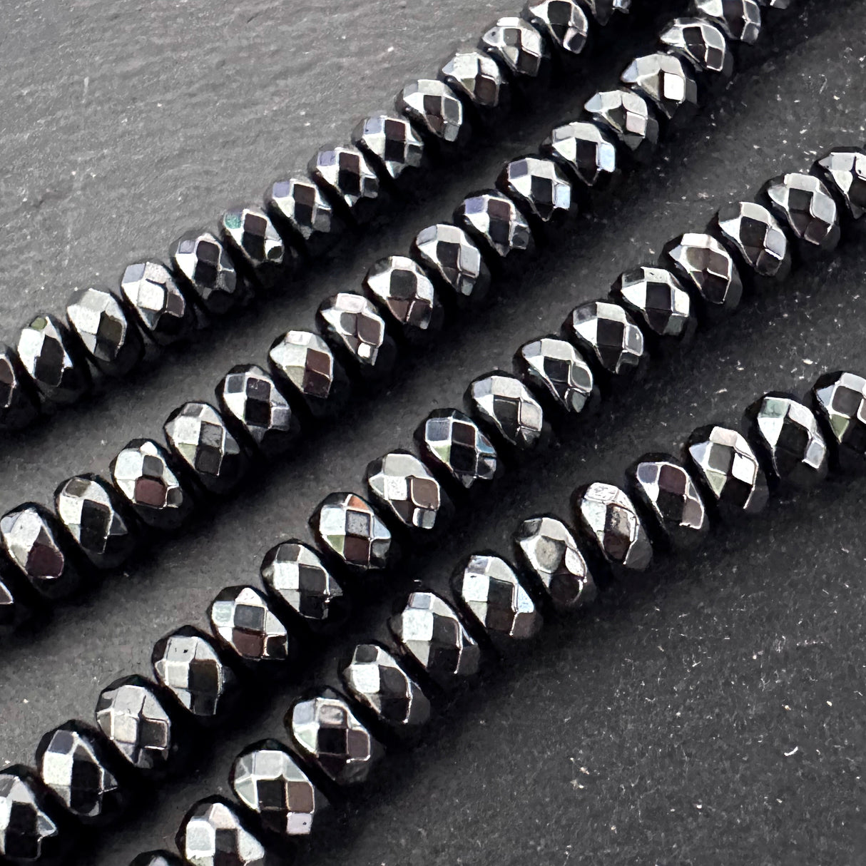 6mm black electroplated hematite beads- rondelle - faceted - 15" strand - approx. 100 beads