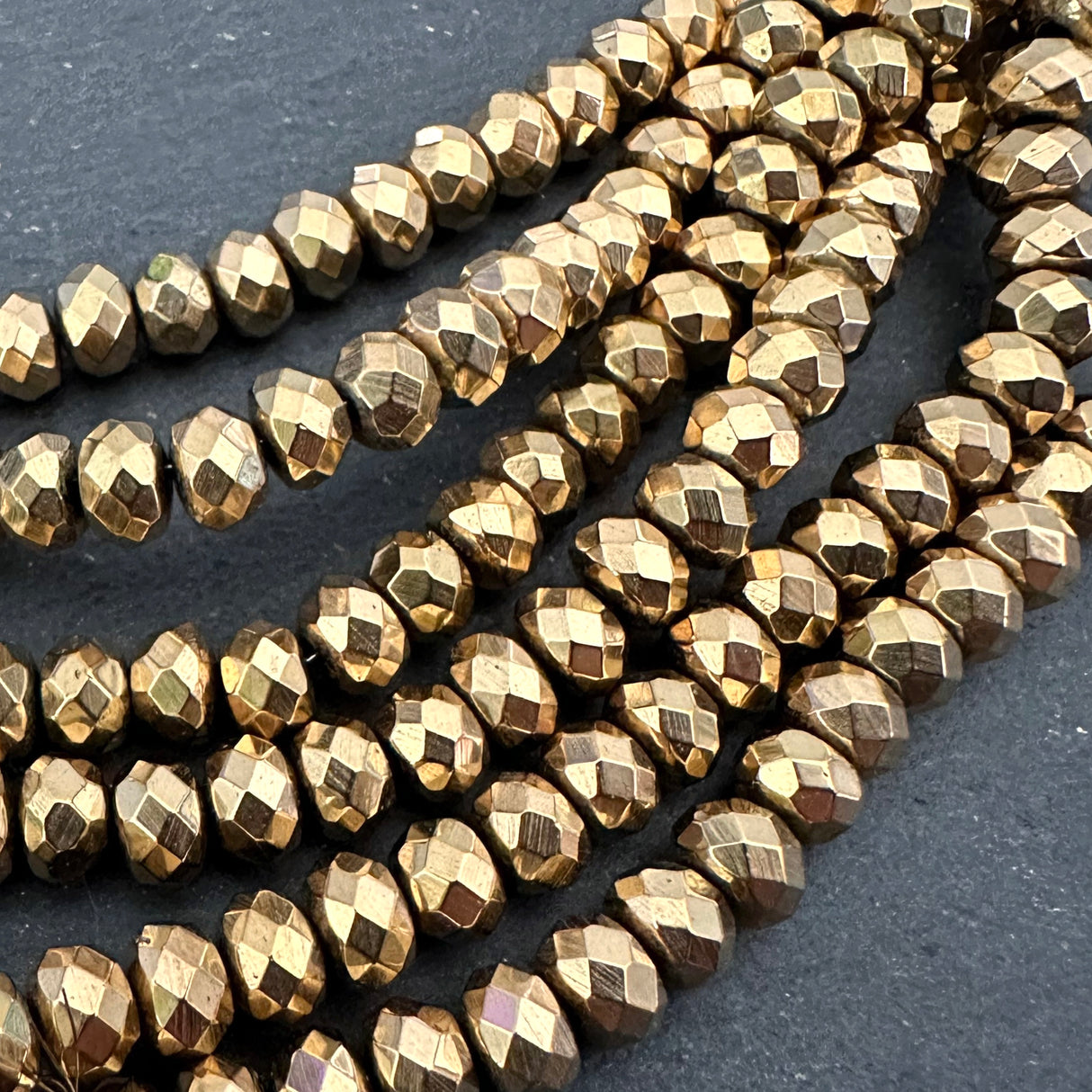 6mm gold electroplated hematite beads - rondelle - faceted - 15" strand - approx. 100 beads