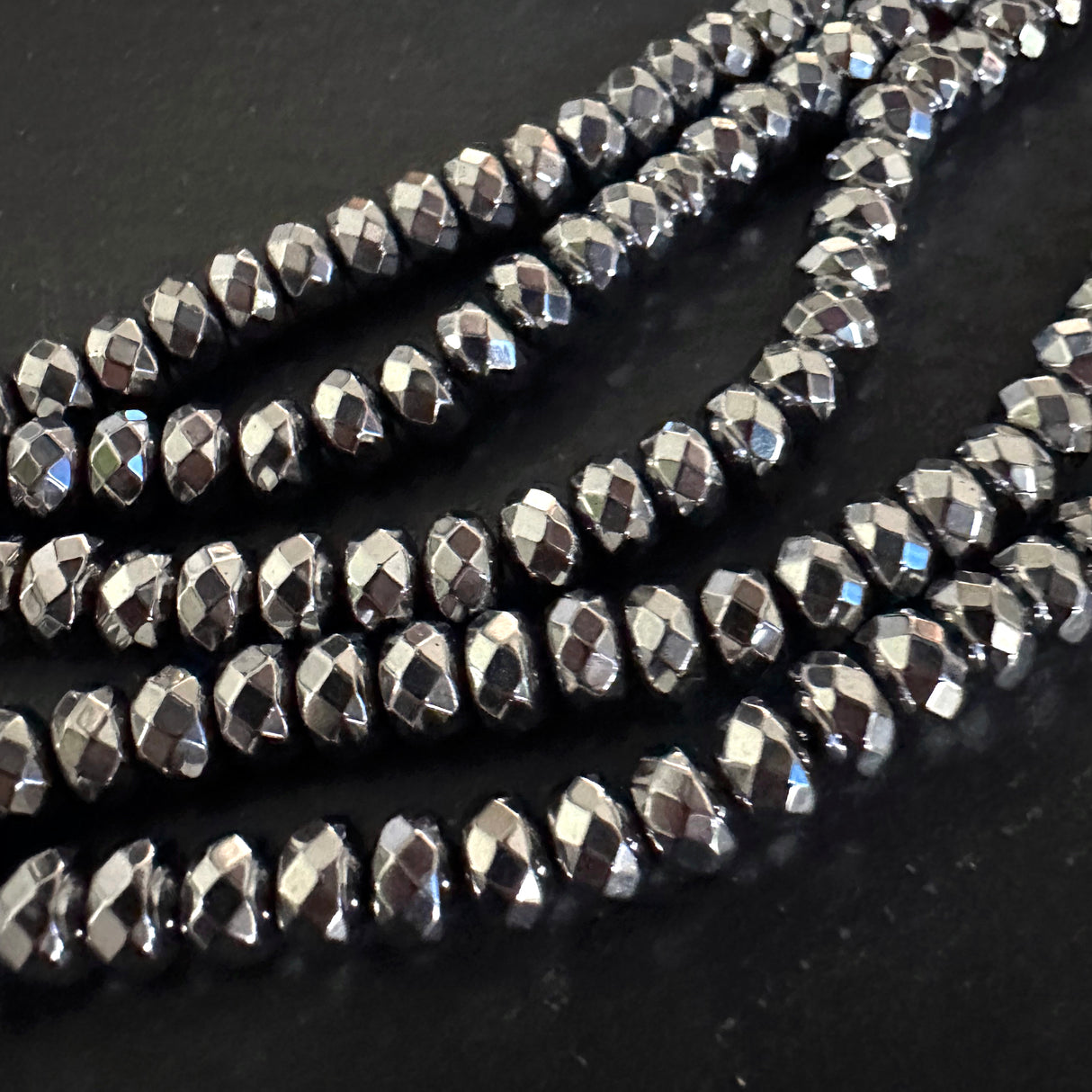 6mm platinum silver electroplated hematite - rondelle - faceted - 15" strand - approx. 65 beads