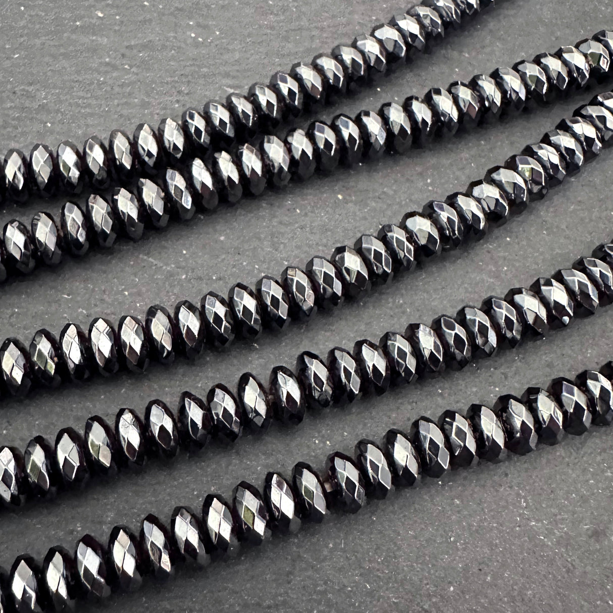 6x3mm black electroplated hematite beads - rondelle - faceted - 15" strand - approx. 125 beads