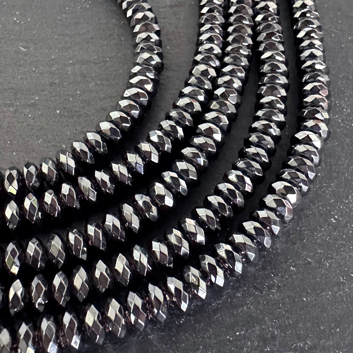 6x3mm black electroplated hematite beads - rondelle - faceted - 15" strand - approx. 125 beads