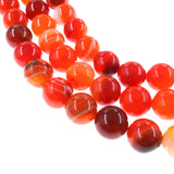 10mm orange striped agate beads - round - smooth - 15" strand - approx. 35 beads ST3-5